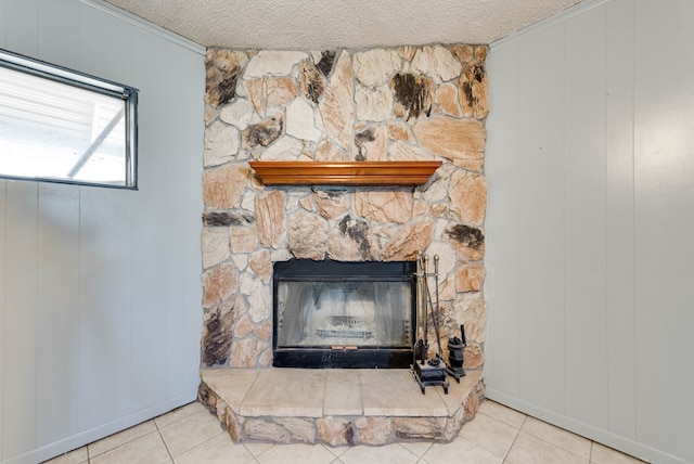 room details featuring crown molding, a fireplace, wooden walls, and a textured ceiling