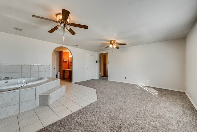 interior space featuring tile patterned floors and ceiling fan