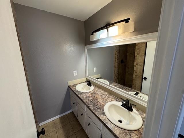 bathroom with tile patterned floors and vanity