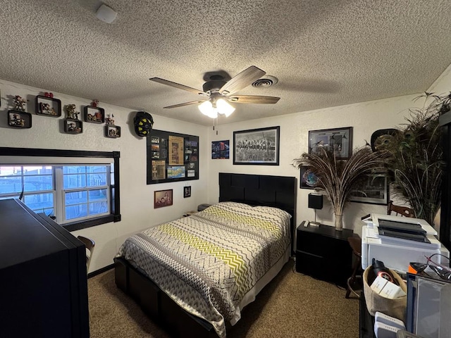 bedroom featuring a textured wall, carpet, ceiling fan, and a textured ceiling