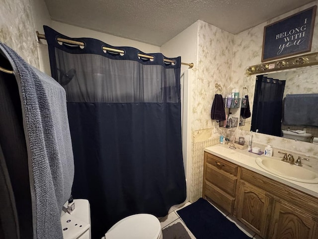 bathroom featuring wallpapered walls, tile patterned floors, curtained shower, a textured ceiling, and vanity