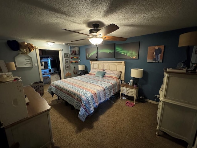 carpeted bedroom with a textured ceiling, ceiling fan, and baseboards