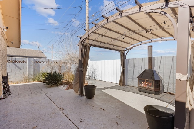 view of patio / terrace featuring a fenced backyard and a pergola