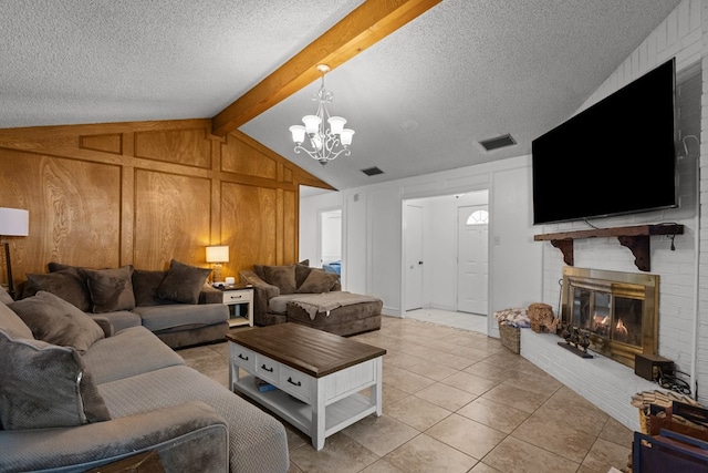 living room with vaulted ceiling with beams, visible vents, a brick fireplace, light tile patterned flooring, and a textured ceiling