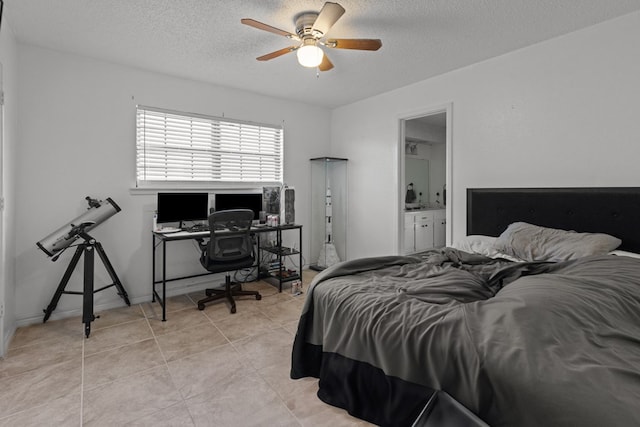 bedroom featuring light tile patterned floors, a textured ceiling, connected bathroom, a ceiling fan, and baseboards