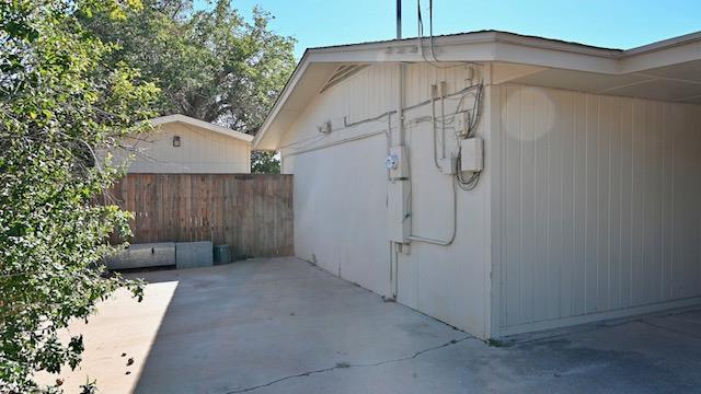 view of side of property featuring a patio area