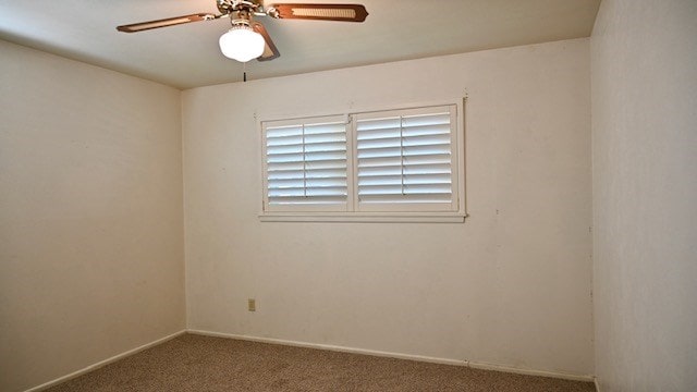 spare room with carpet flooring and ceiling fan