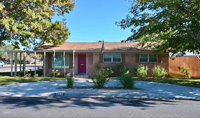 ranch-style house with a carport