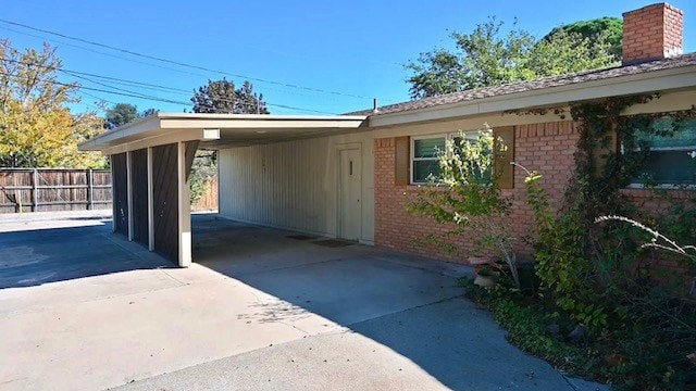 exterior space with a carport