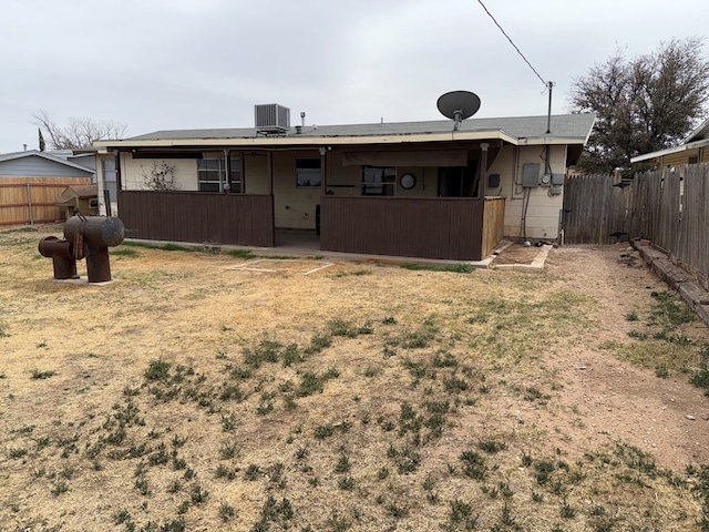 back of house featuring cooling unit and a fenced backyard