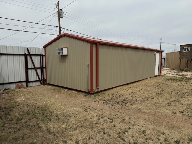 view of outbuilding featuring an outbuilding and an AC wall unit