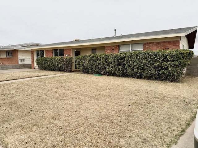 single story home with brick siding