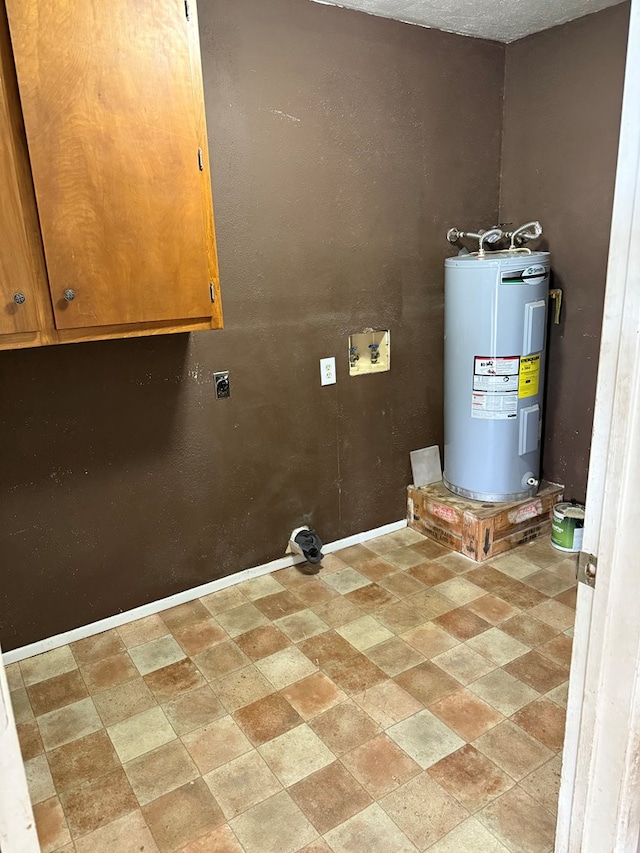 utility room featuring electric water heater