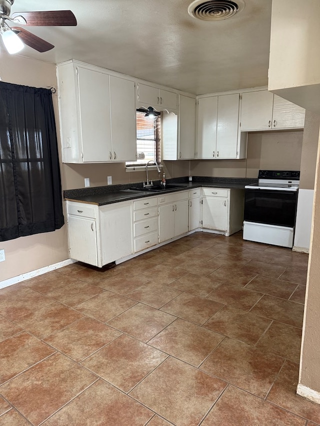 kitchen with dark countertops, visible vents, ceiling fan, range with electric stovetop, and a sink