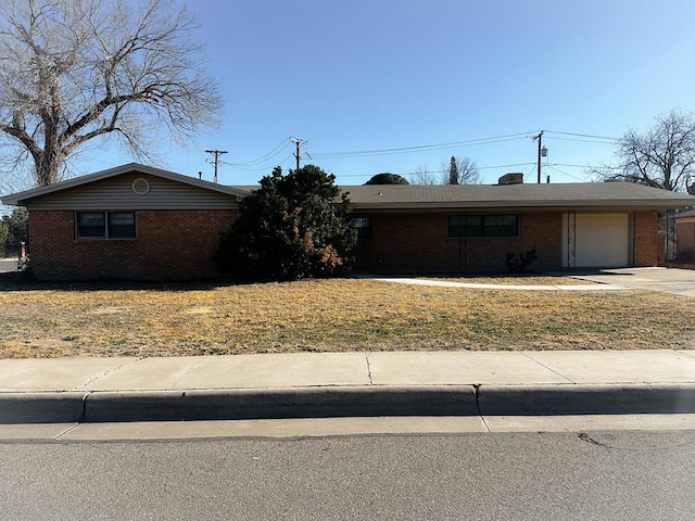 single story home featuring a garage