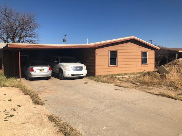 view of property exterior with a carport