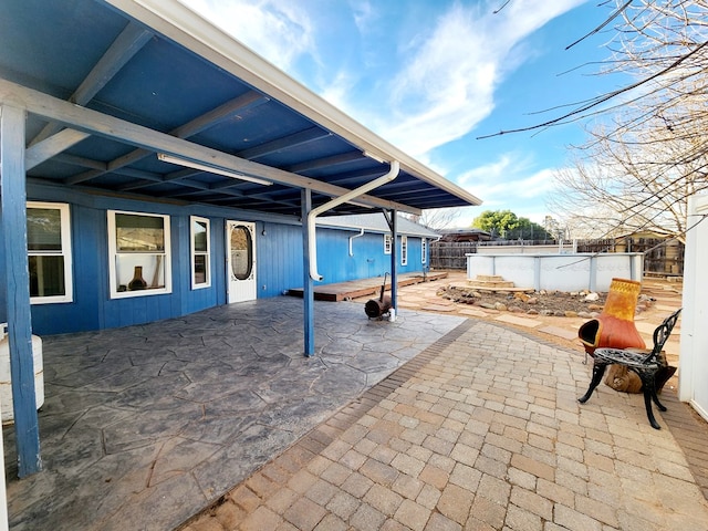 view of patio featuring fence