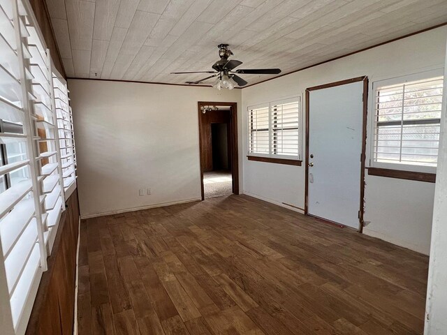 spare room featuring ceiling fan, dark hardwood / wood-style flooring, and wooden ceiling