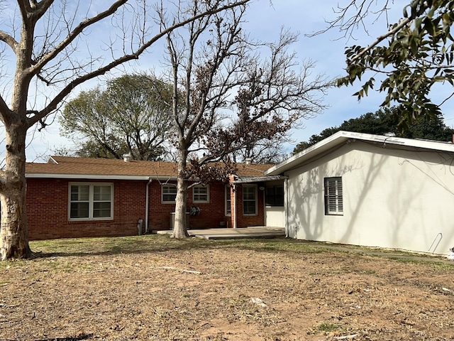 rear view of house featuring a patio