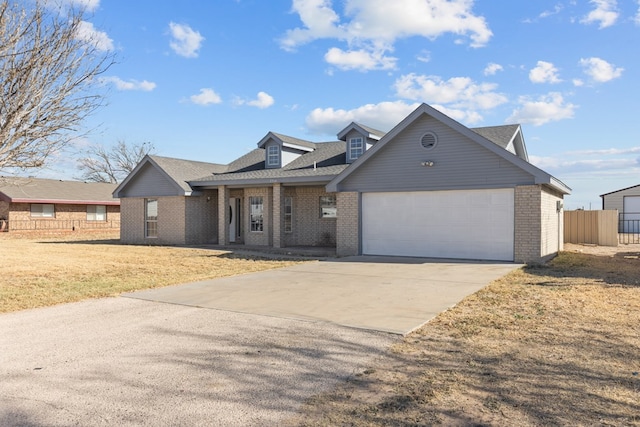 view of front of property featuring a garage and a front yard