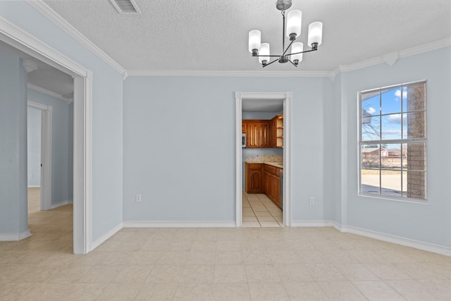 unfurnished dining area with crown molding, a notable chandelier, and a textured ceiling