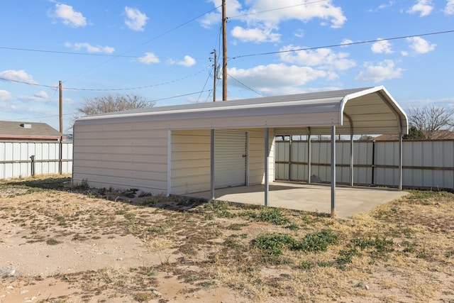 view of outbuilding featuring a carport