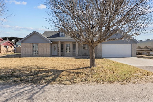 view of front facade with a garage and a front lawn