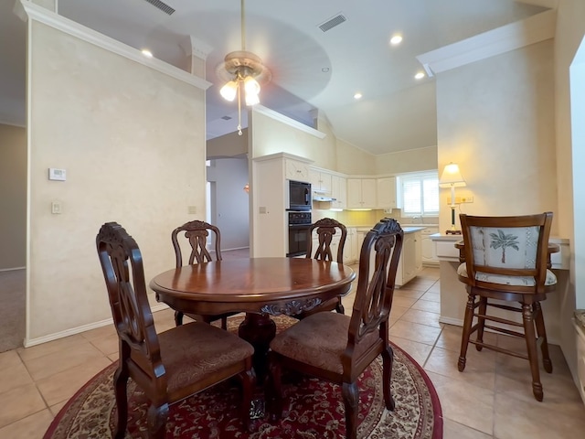 dining area with light tile patterned flooring, ceiling fan, and ornamental molding