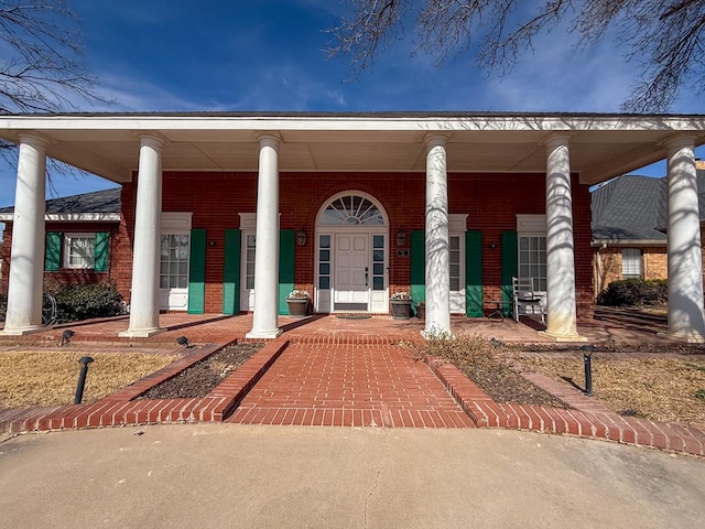 doorway to property featuring a porch