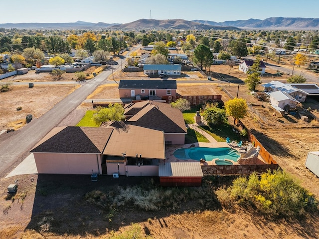 birds eye view of property with a mountain view