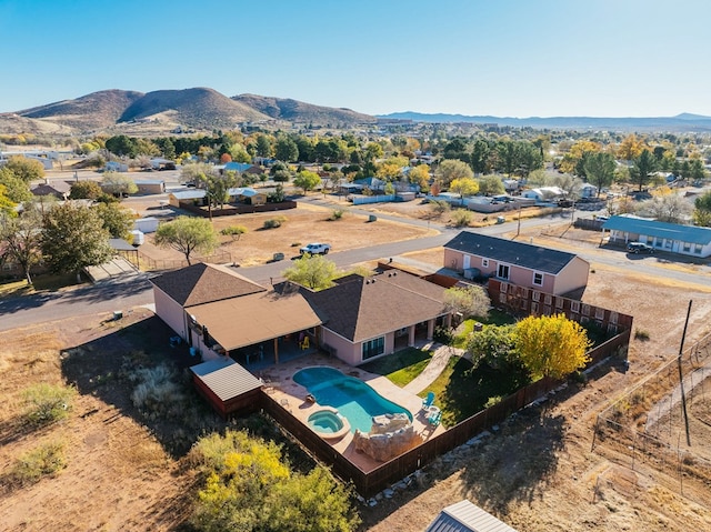 birds eye view of property featuring a mountain view