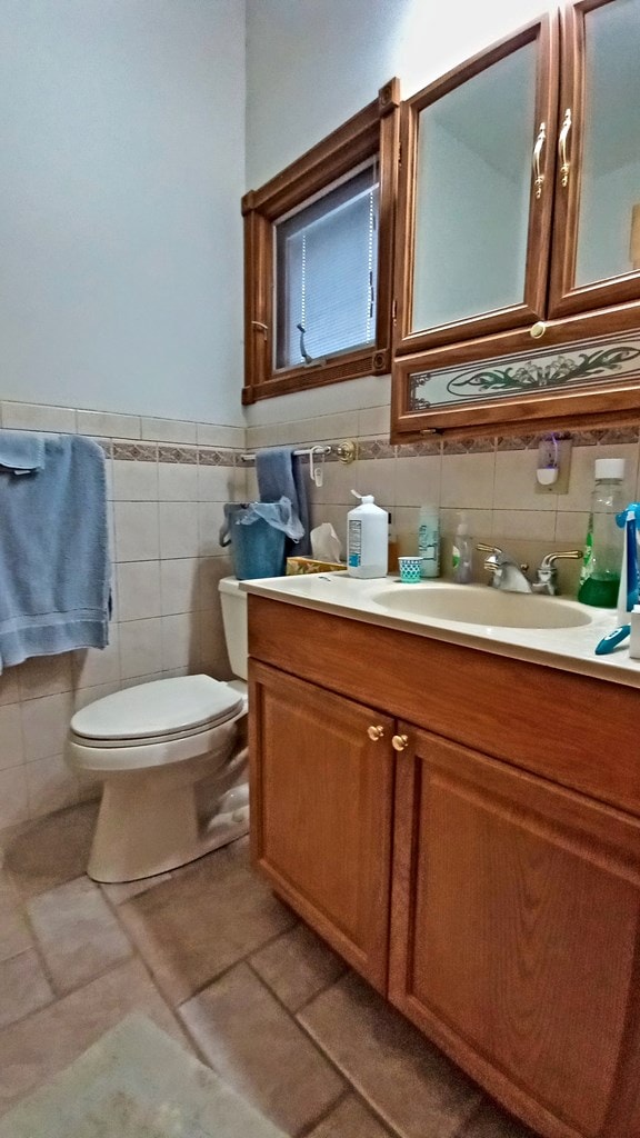 half bath with vanity and toilet