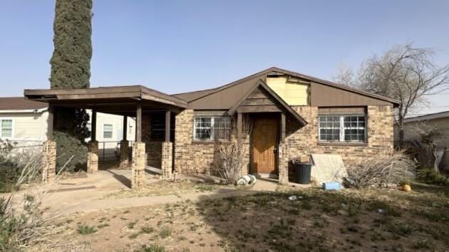 view of front of house with brick siding