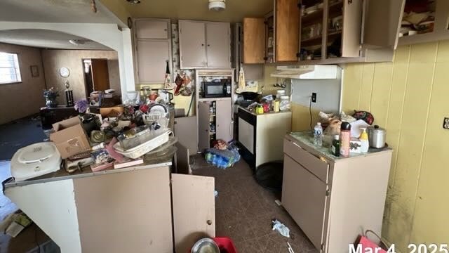 kitchen featuring black microwave