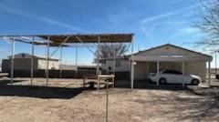 exterior space featuring a carport