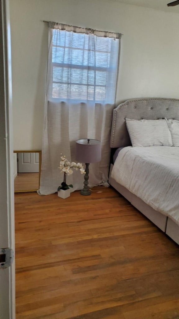 bedroom featuring hardwood / wood-style floors