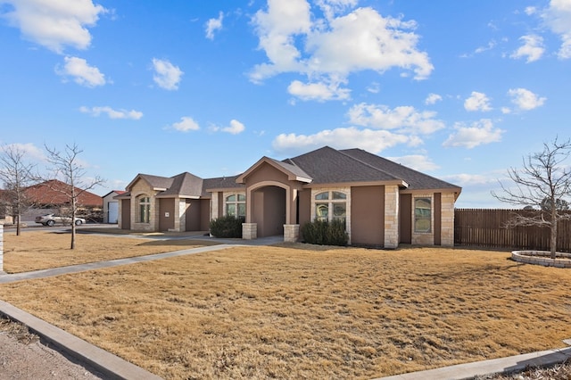 ranch-style house with a front lawn