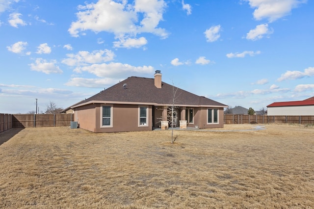 rear view of house featuring central air condition unit