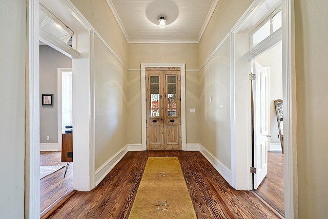 doorway with dark hardwood / wood-style floors and crown molding