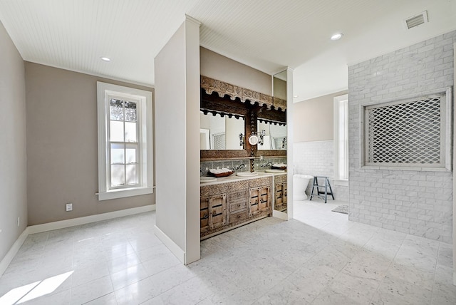 bathroom with vanity and a bathtub