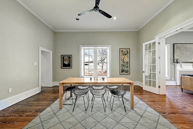 dining room with wood-type flooring, french doors, ceiling fan, and crown molding