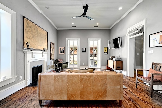 living room with dark hardwood / wood-style flooring, wooden ceiling, ceiling fan, and ornamental molding