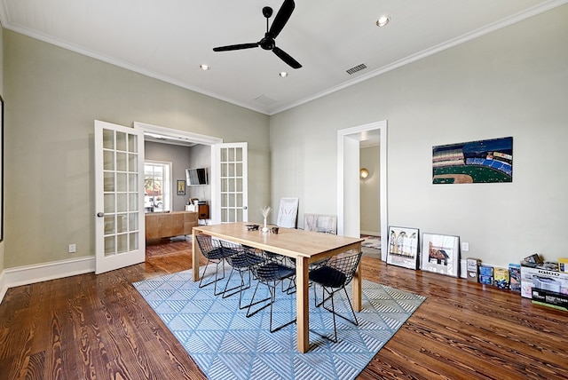 dining space featuring crown molding, ceiling fan, french doors, and dark wood-type flooring