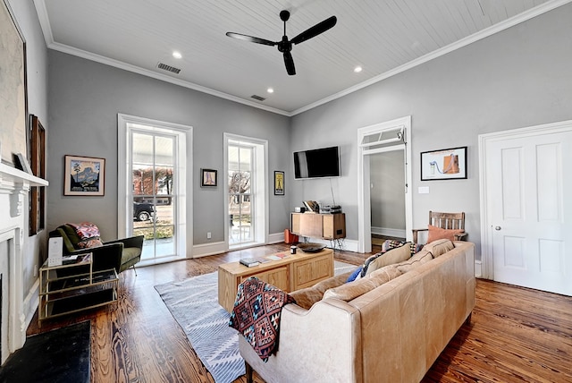 living room featuring ceiling fan, dark hardwood / wood-style flooring, and ornamental molding