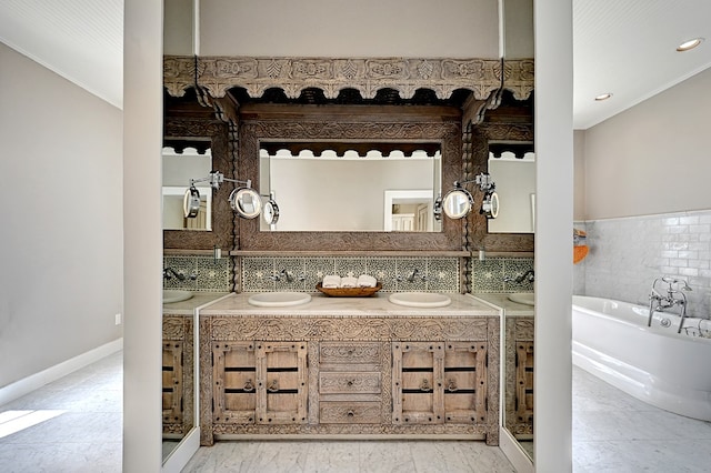 bathroom with vanity and a tub