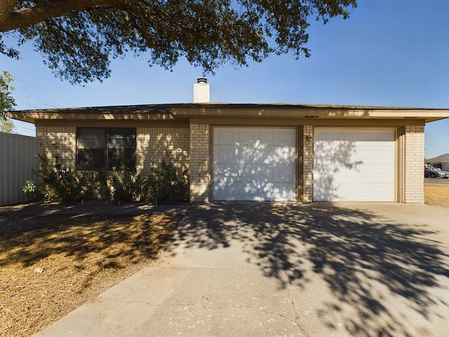 single story home with a garage