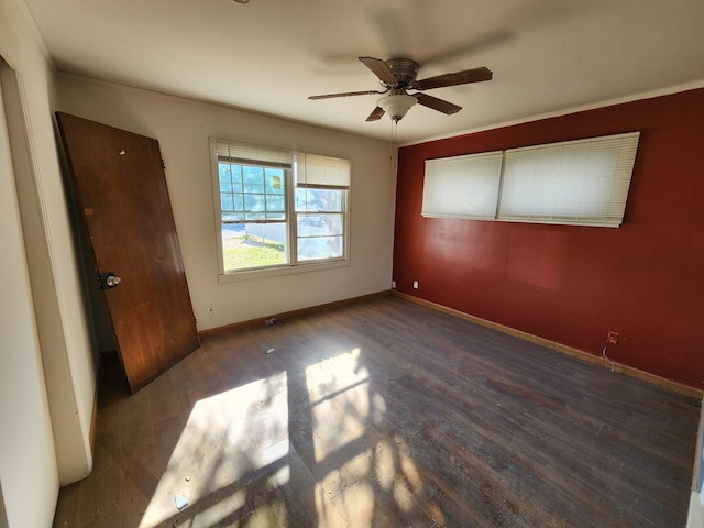 unfurnished bedroom with dark hardwood / wood-style floors and ceiling fan