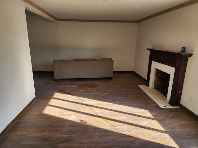 unfurnished living room featuring dark hardwood / wood-style floors, crown molding, and a fireplace