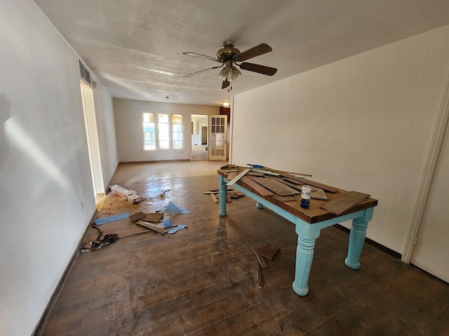 interior space featuring a textured ceiling, dark hardwood / wood-style flooring, and ceiling fan