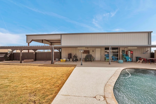 view of outdoor structure with a fenced in pool and fence